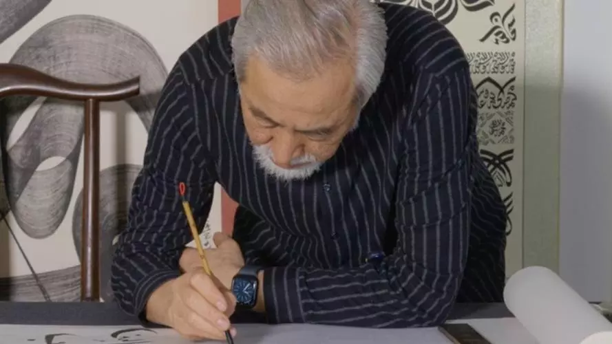 A calligrapher working on a manuscript