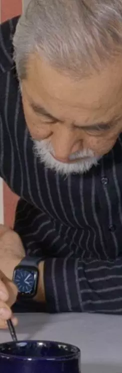 A calligrapher working on a manuscript